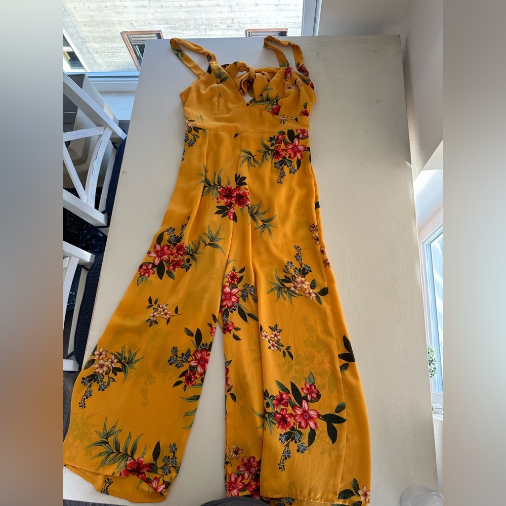 Yellow floral jumpsuit with low back size S